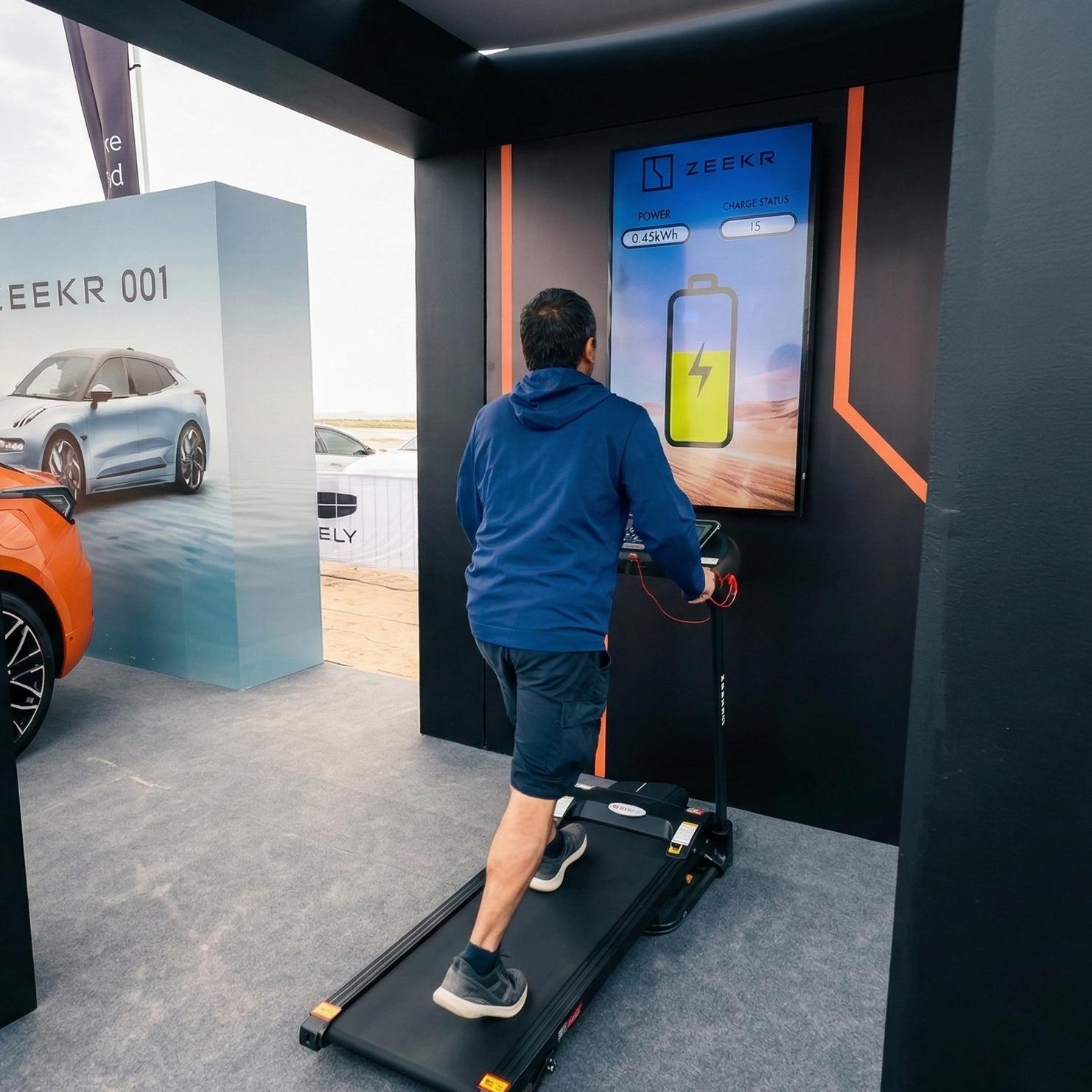 Interactive Treadmill Activation in Dubai: Participants generating human power to recharge EV cars